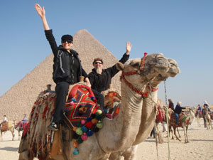 Camel Riders by the Pyramids